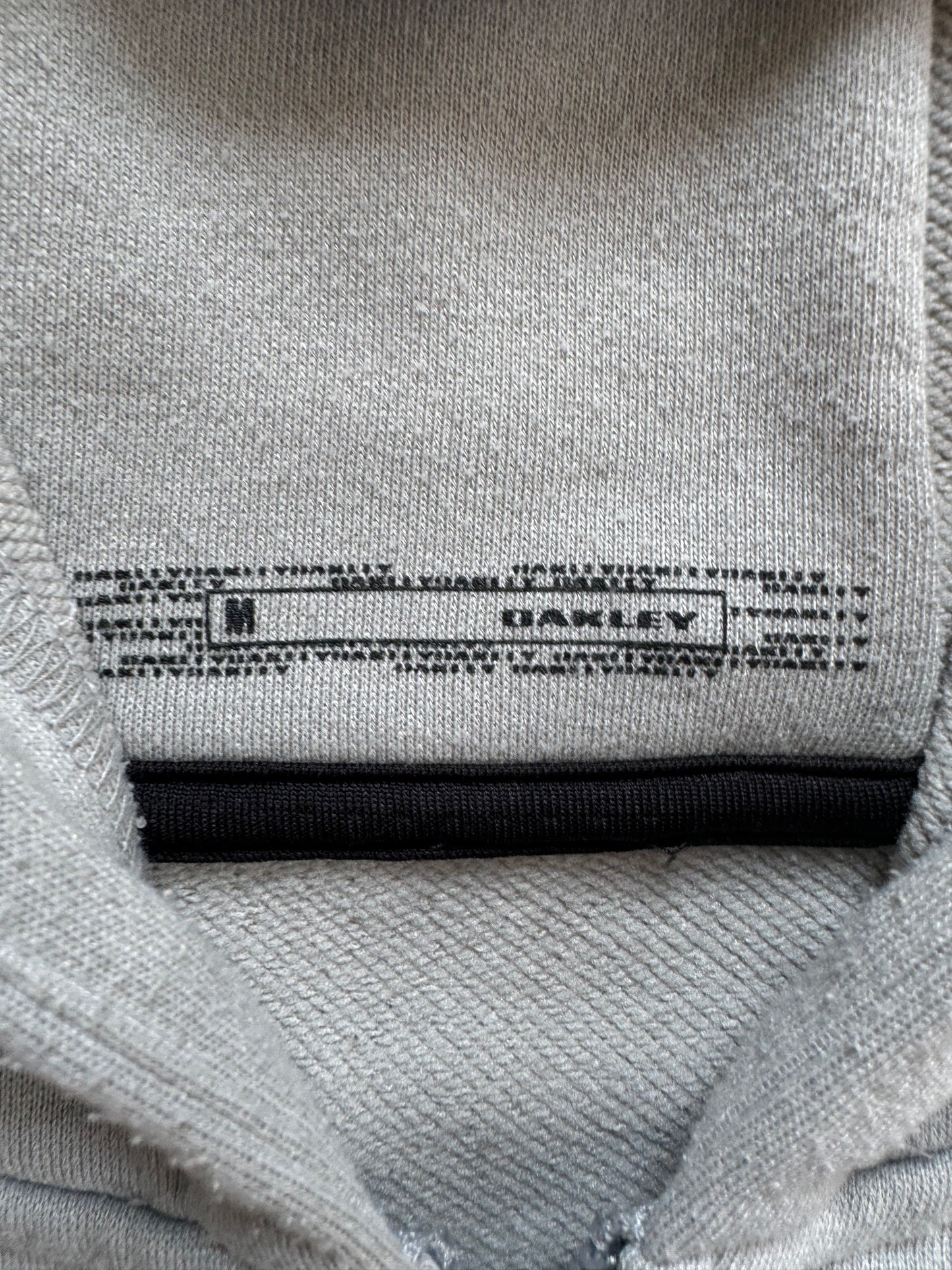 Vintage 2000's black and light grey Oakley graphic print logo zip up technical hoodie (M)