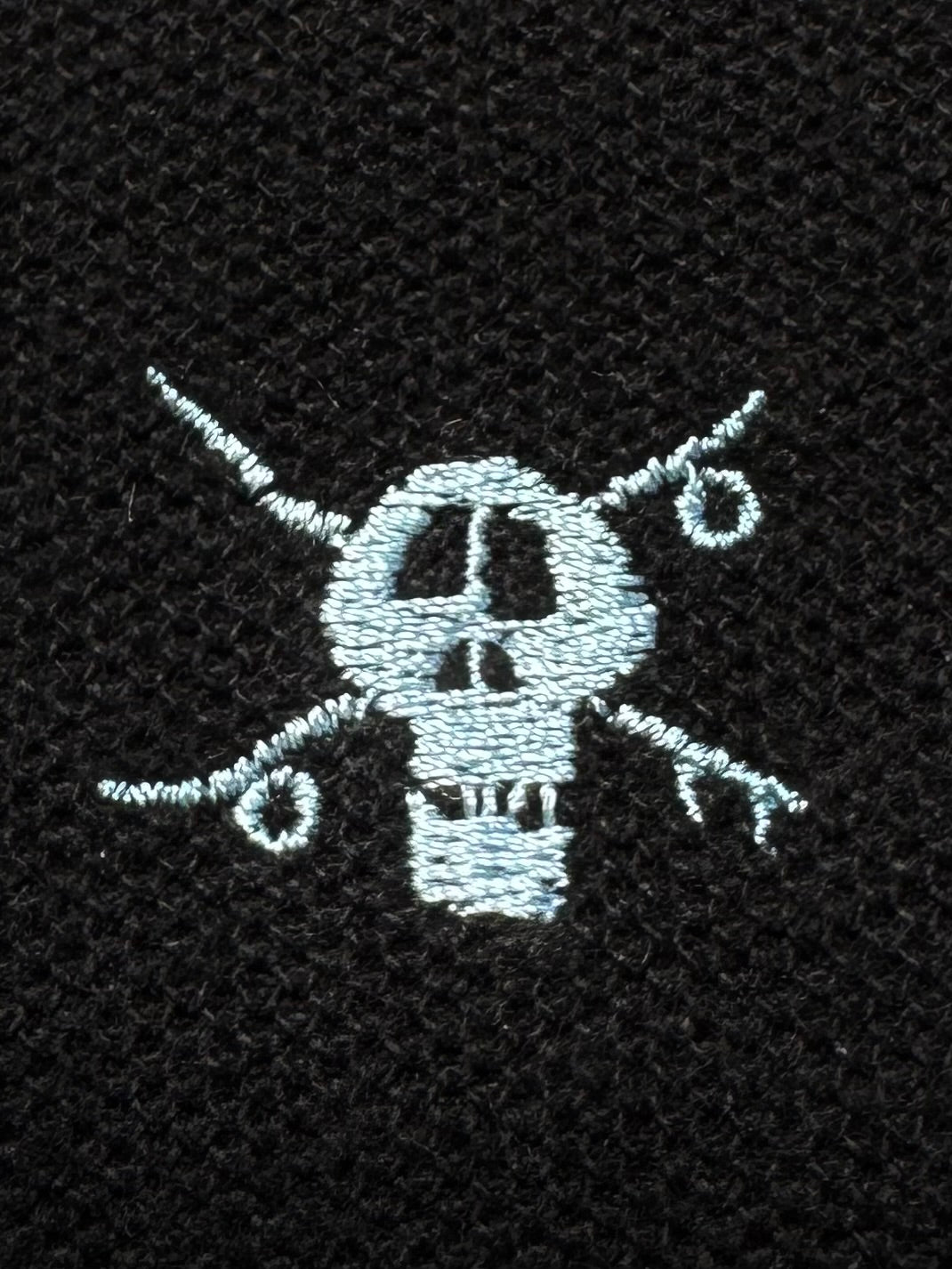 Vintage 2000's black stussy skull embroidered polo shirt (M)