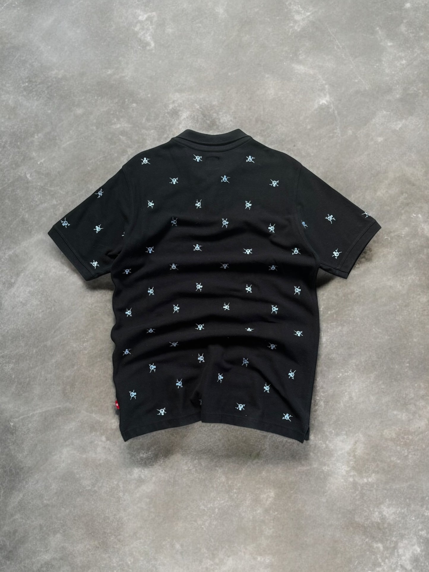Vintage 2000's black stussy skull embroidered polo shirt (M)