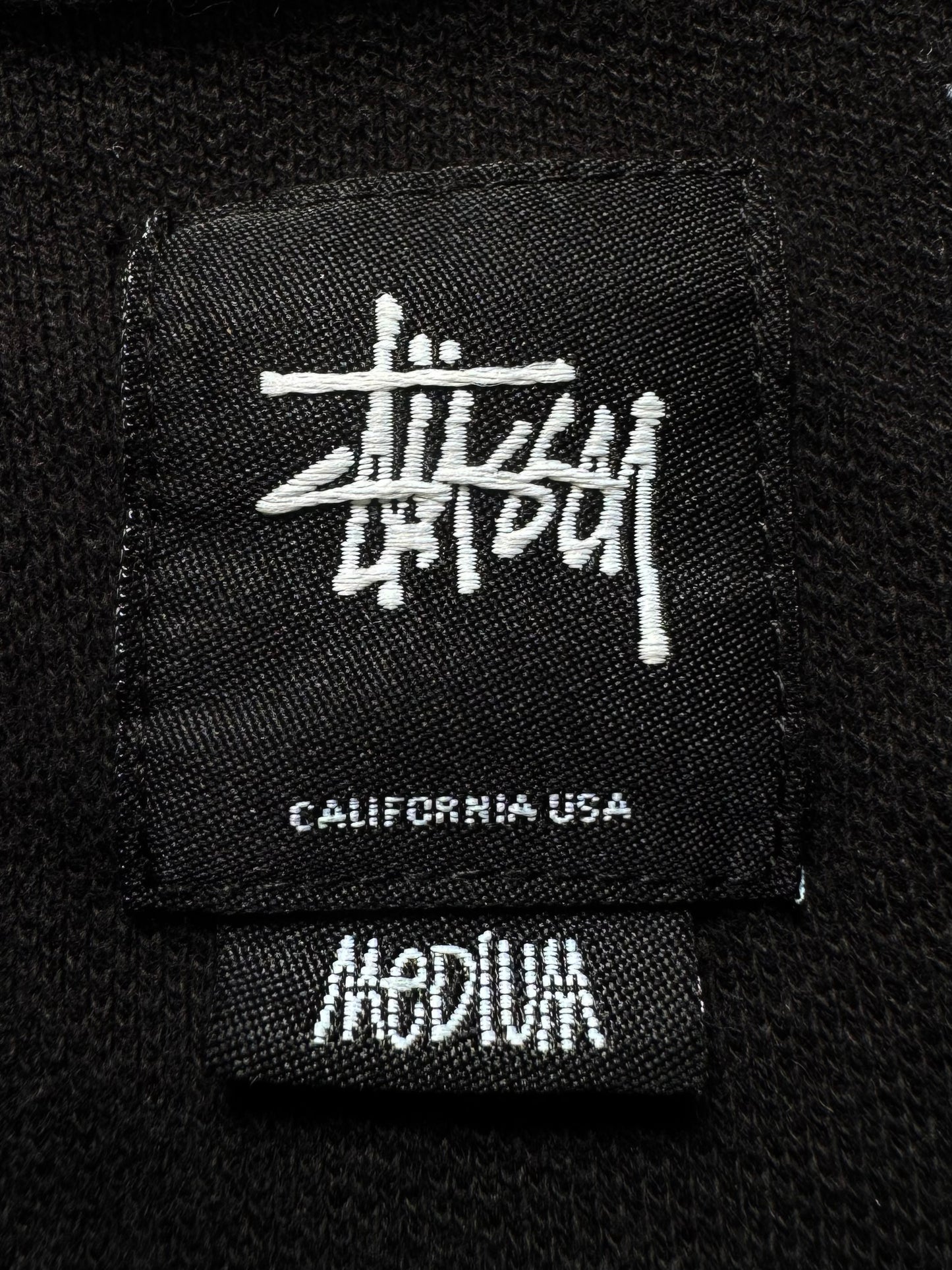 Vintage 2000's black stussy skull embroidered polo shirt (M)