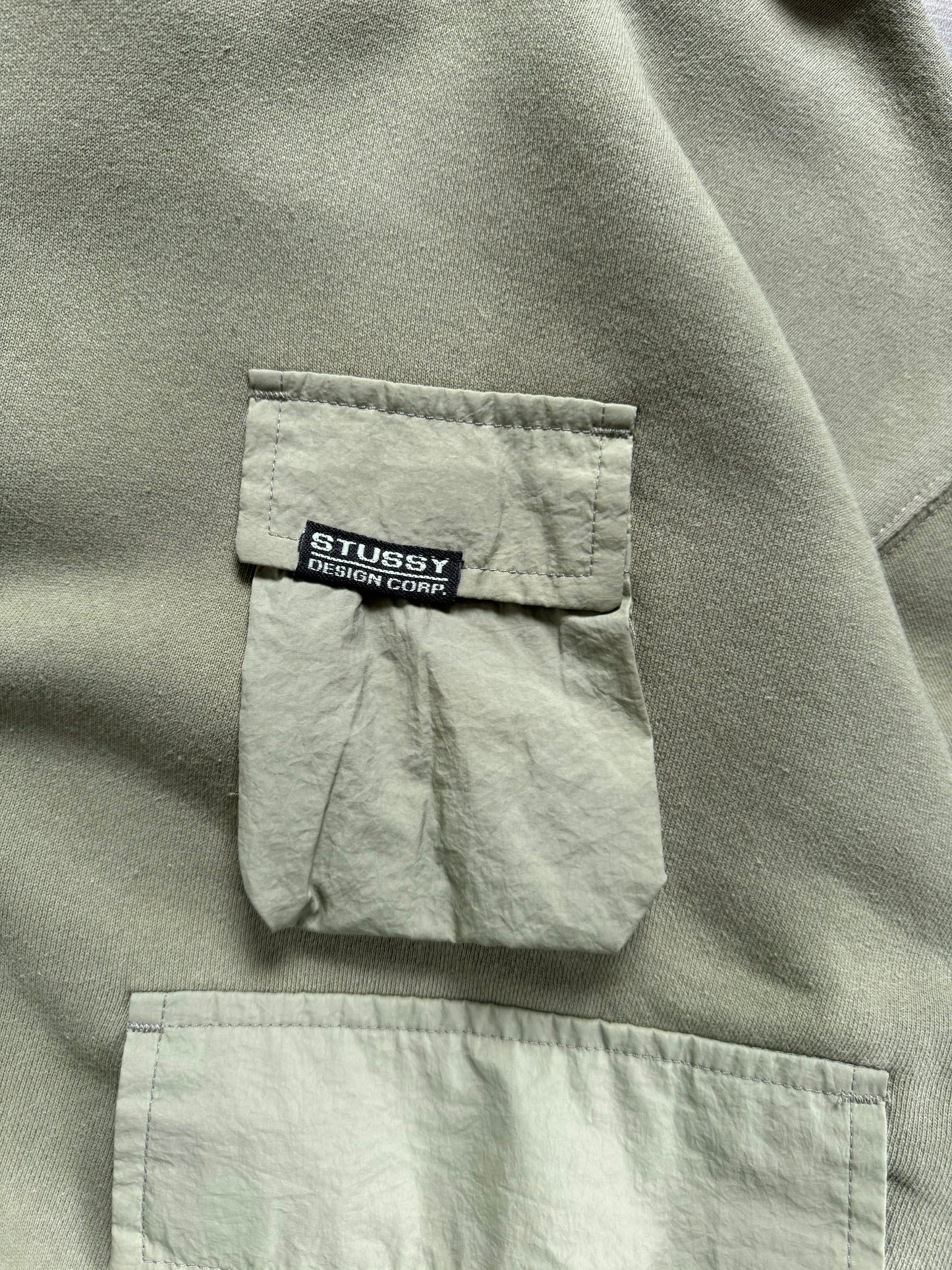 Vintage sage / khaki green Stussy technical cargo hoodie (M)