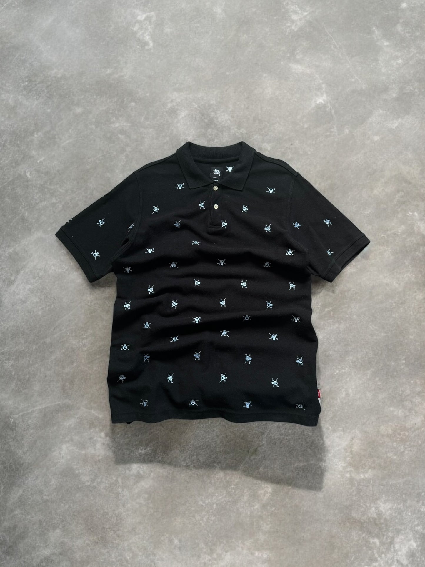 Vintage 2000's black stussy skull embroidered polo shirt (M)