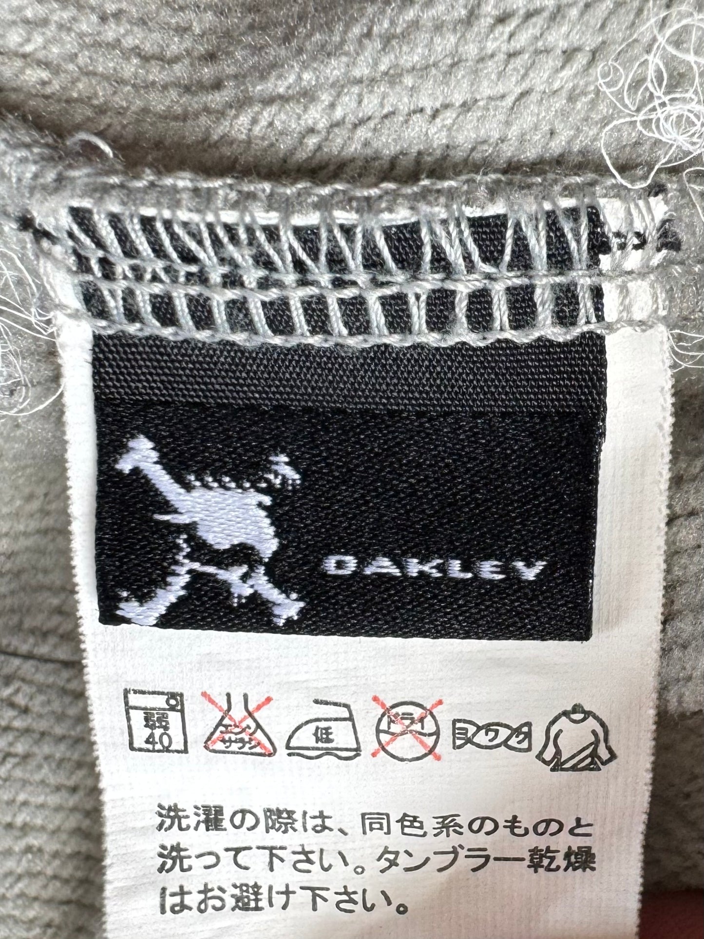 Vintage 2000's black and light grey Oakley graphic print logo zip up technical hoodie (M)