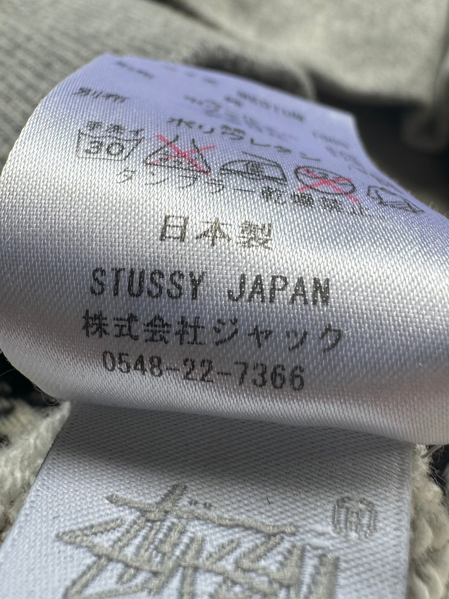 Vintage 2000's grey white and black Stussy tartan plaid jumper (S)
