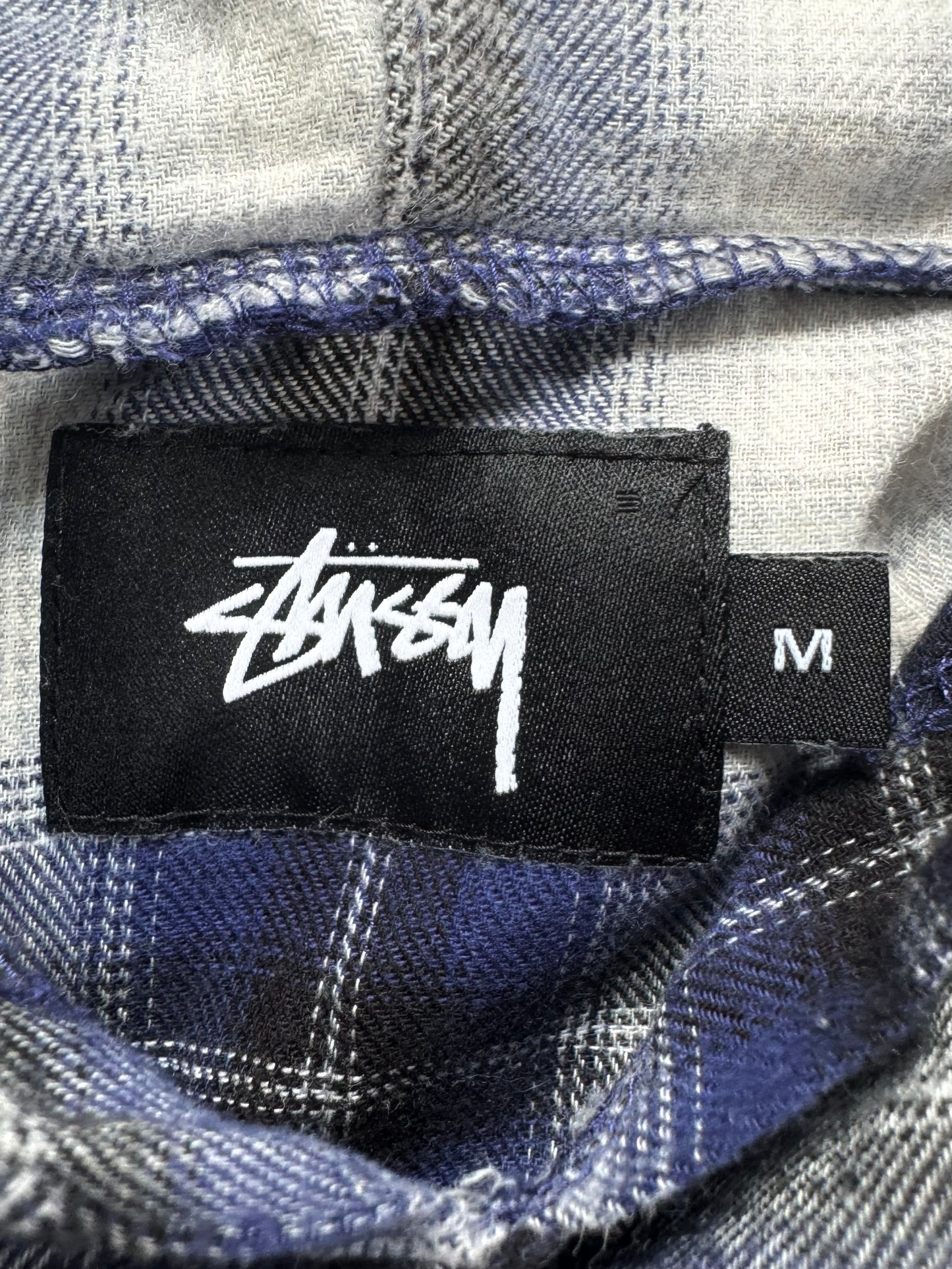 Vintage navy blue white and black Stussy spell out logo tartan / plaid hoodie (M)