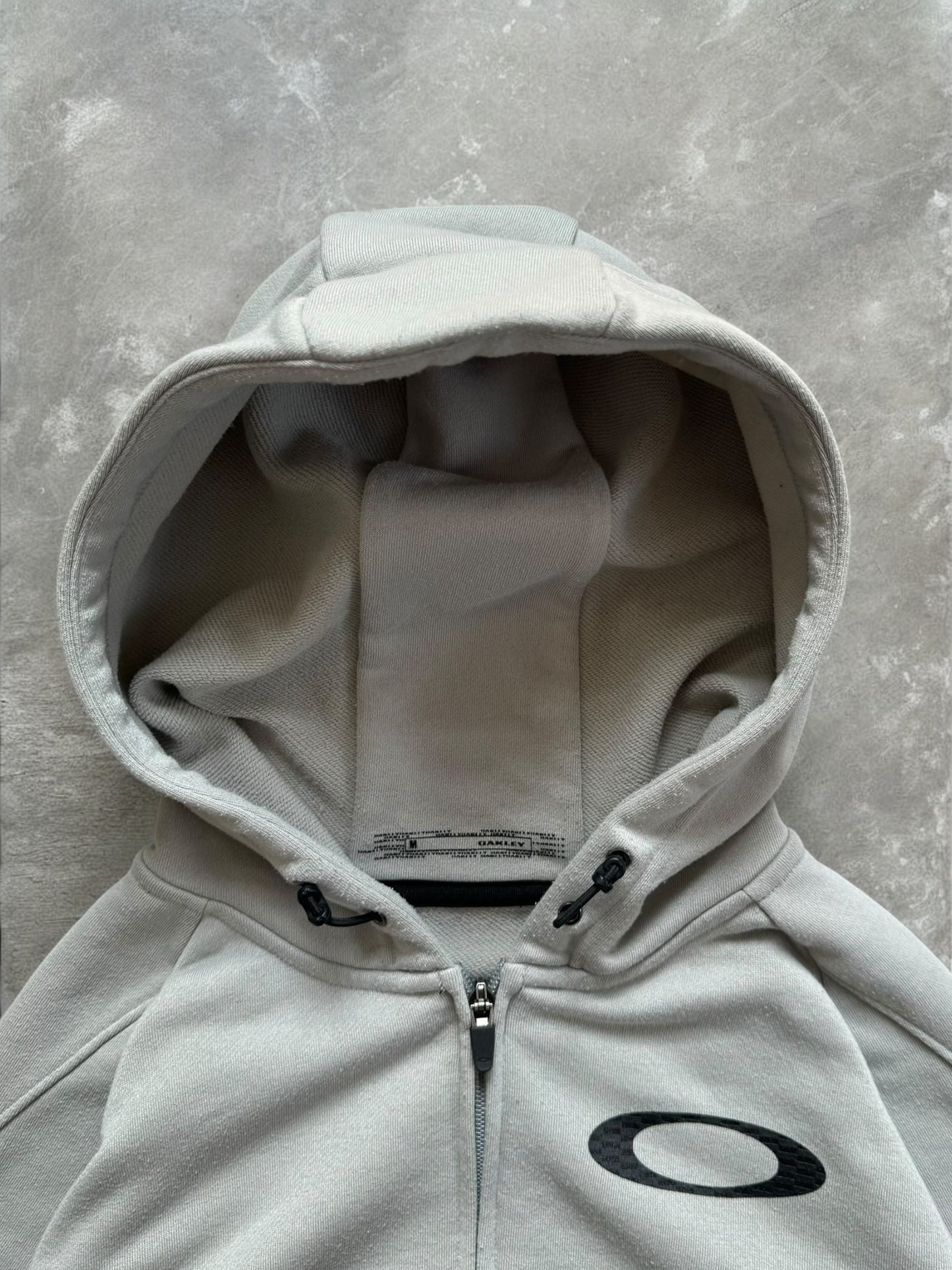Vintage 2000's black and light grey Oakley graphic print logo zip up technical hoodie (M)