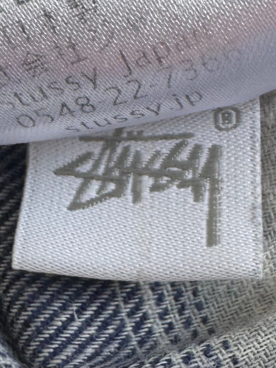 Vintage navy blue white and black Stussy spell out logo tartan / plaid hoodie (M)