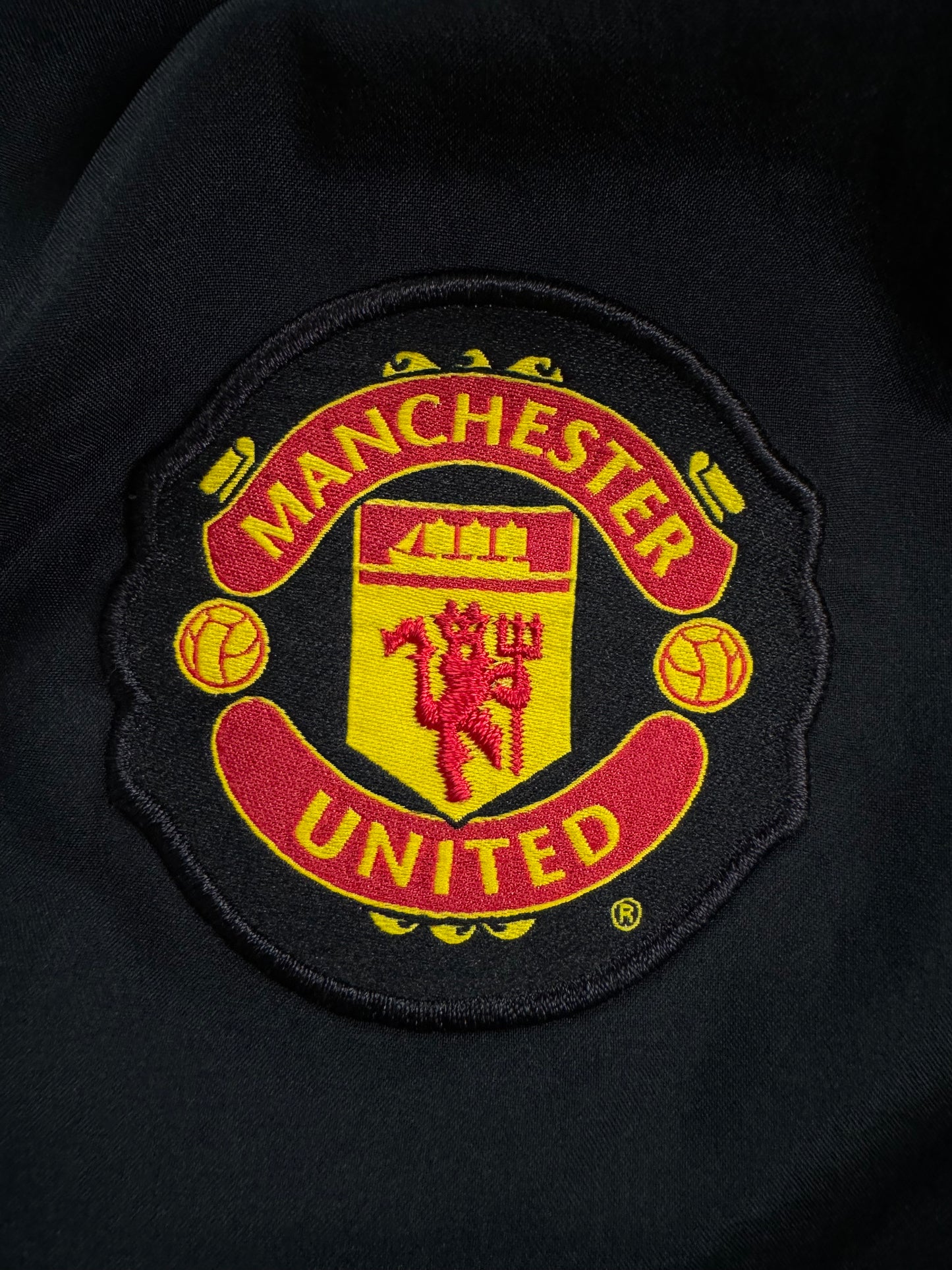 Vintage 2000's black Nike Manchester United football joggers/track pants (M)